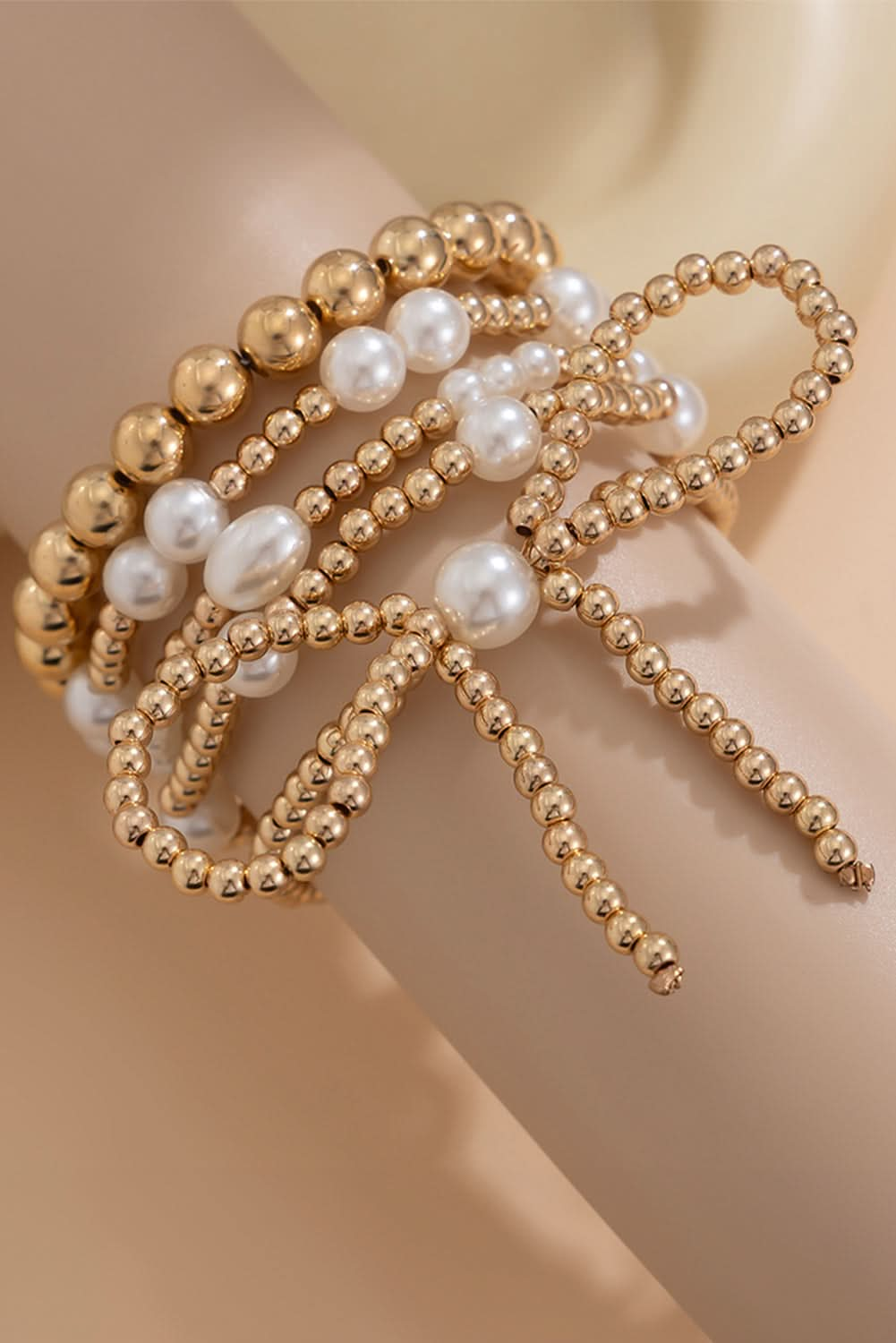 Gold Bow Knot Pearl Beaded Multi Layered Bracelet Set.