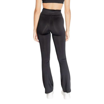 Black high-waisted flared yoga pants shown from behind.