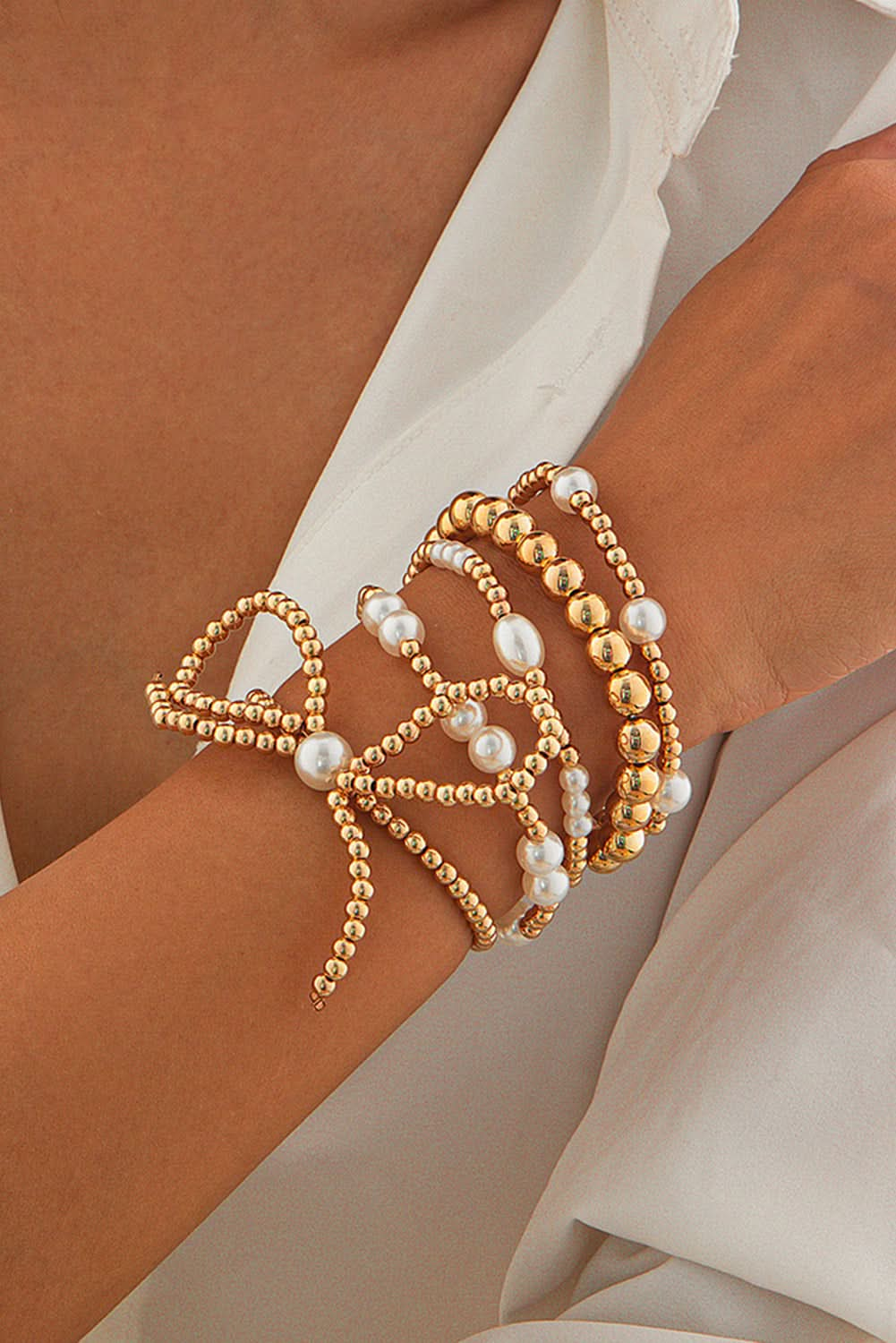 Gold Bow Knot Pearl Beaded Multi Layered Bracelet Set.