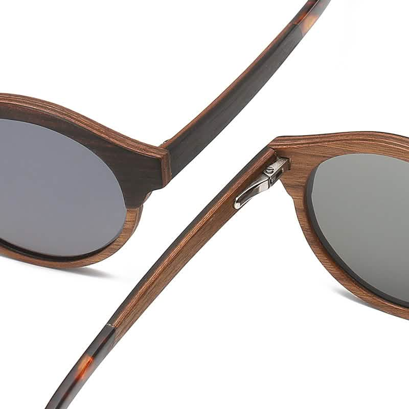 Close-up of laminated wood and solid wood round frame retro fashion sunglasses with gray lenses, shown on a product page.