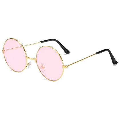 Retro round sunglasses with a thin gold frame, pink-tinted lenses, and black temple tips displayed on a white background.