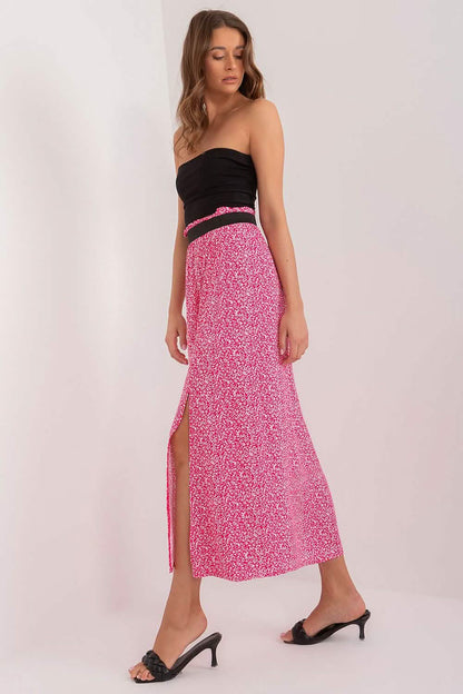 Pink floral midi skirt with a side slit and black waistband.