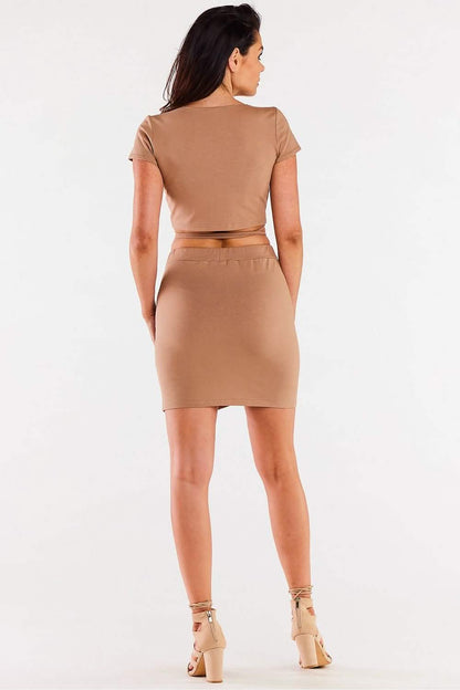 Tan bodycon dress with a midriff cutout shown from the back view.