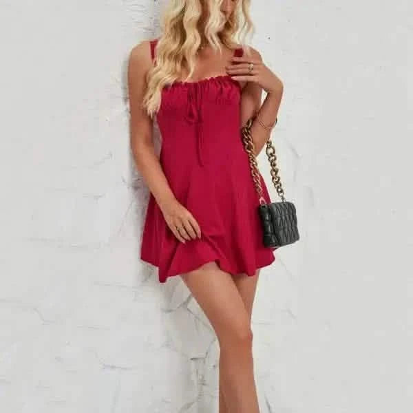 Red sleeveless mini dress with a ruffled neckline.