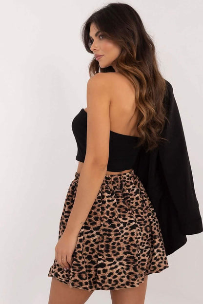 Leopard print mini skirt paired with a black strapless top.