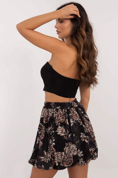 Floral print mini skirt with a gathered waist and flowing silhouette.