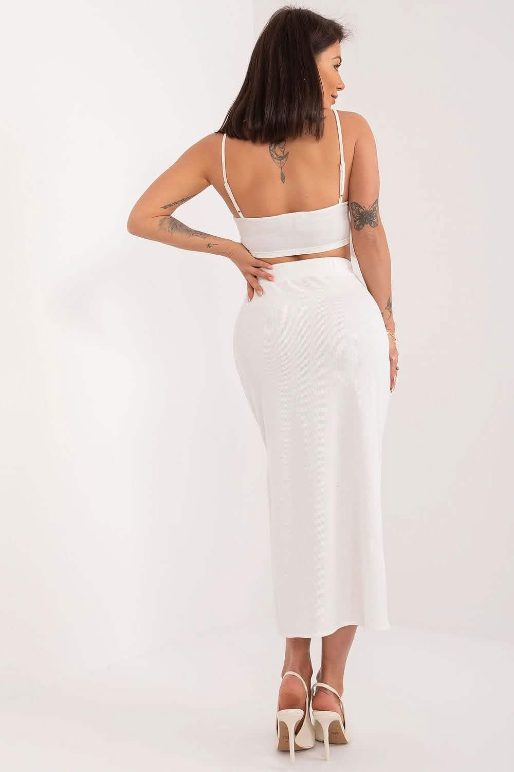 White two-piece fitted dress with a crop top and midi-length skirt.