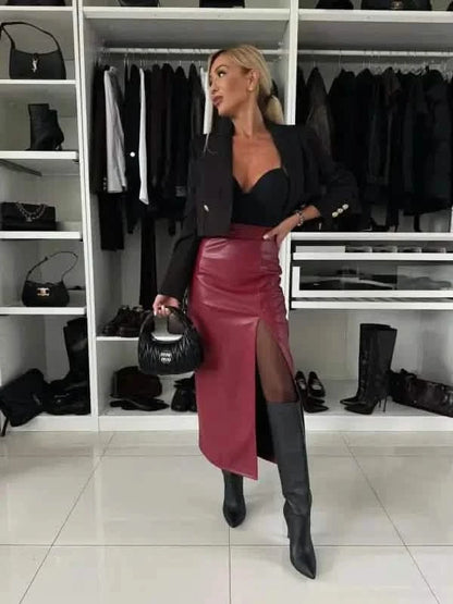 Burgundy leather midi skirt with a dramatic side slit.