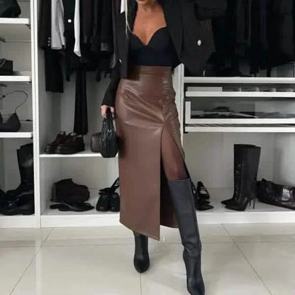 Brown leather midi skirt with a thigh-high slit paired with black boots.