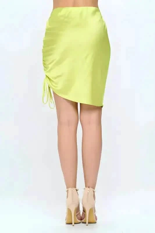 Neon yellow ruched mini skirt with side drawstring detail.