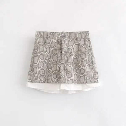 Mini skirt with gray and white snakeskin print pattern.