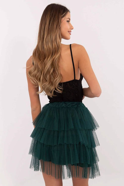 Layered emerald green tulle mini skirt with a ruffled tiered design.