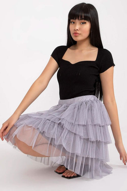 Ruffled gray tulle skirt paired with a black fitted top.