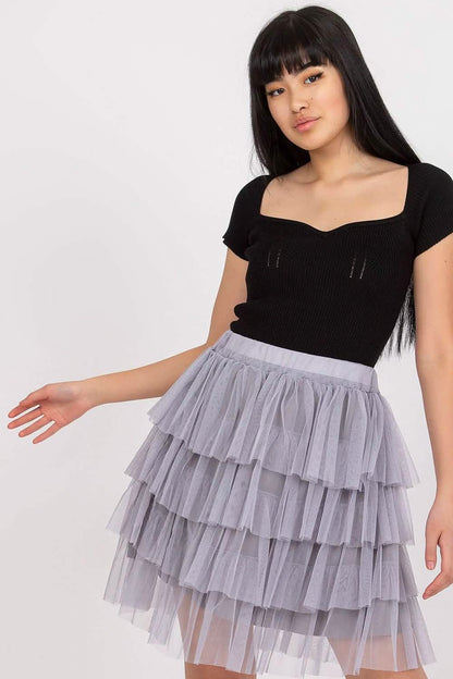 Tiered tulle skirt in light grey paired with a black fitted top.