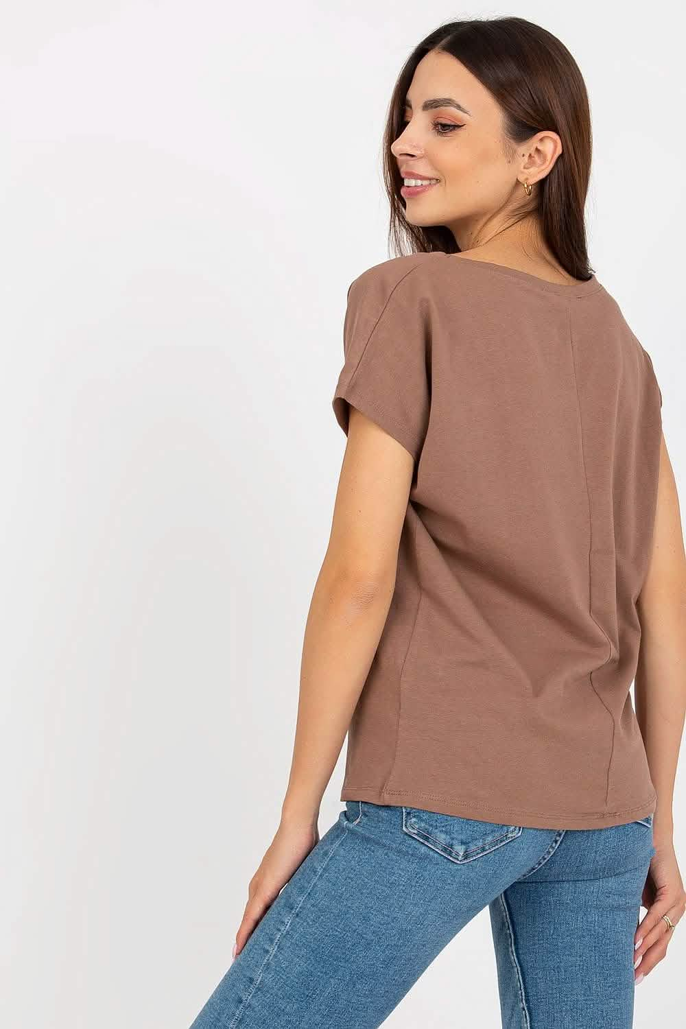 Brown short-sleeved blouse paired with blue jeans.