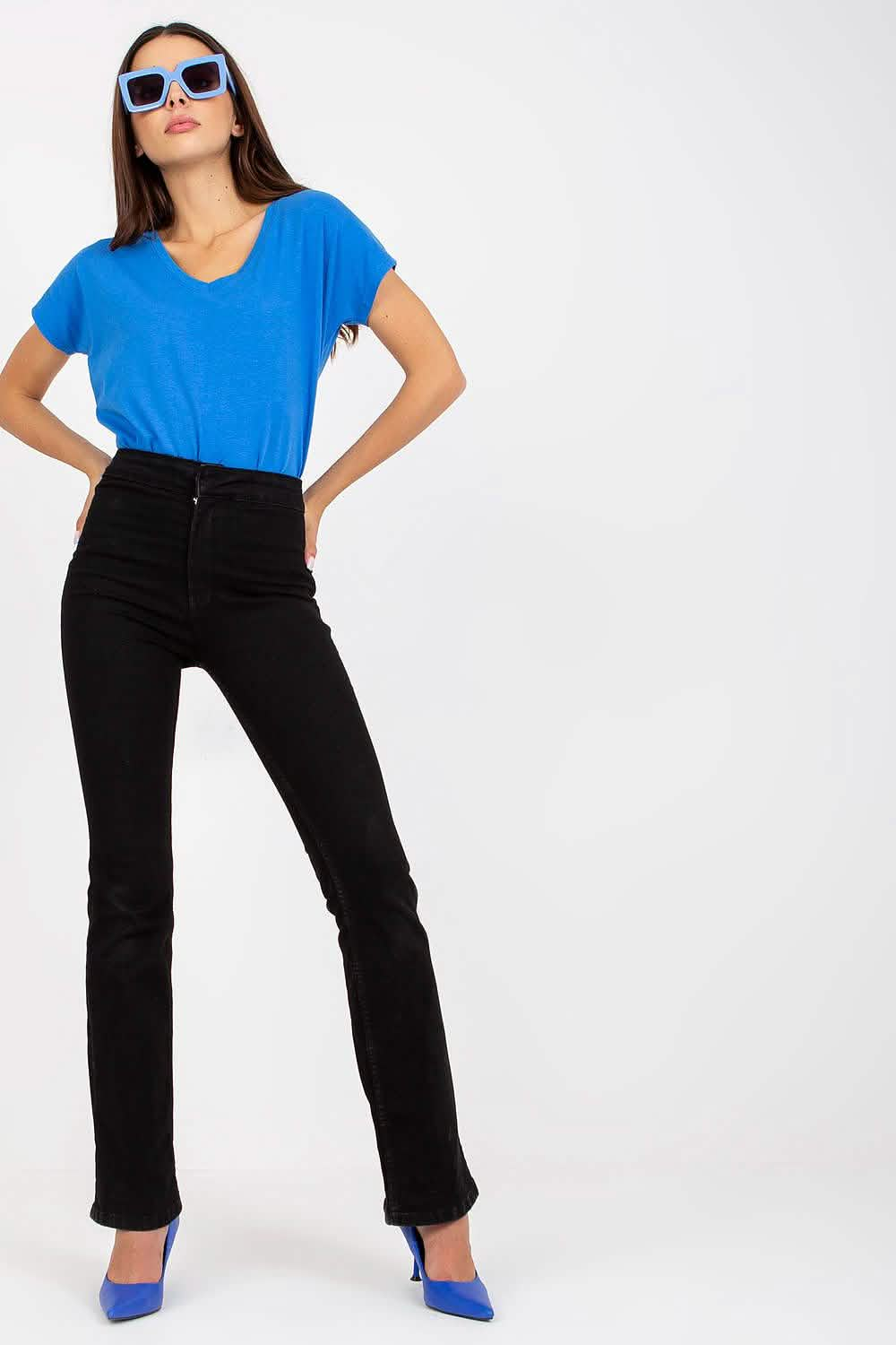 Black high-waisted flared pants paired with a bright blue t-shirt and blue heels.