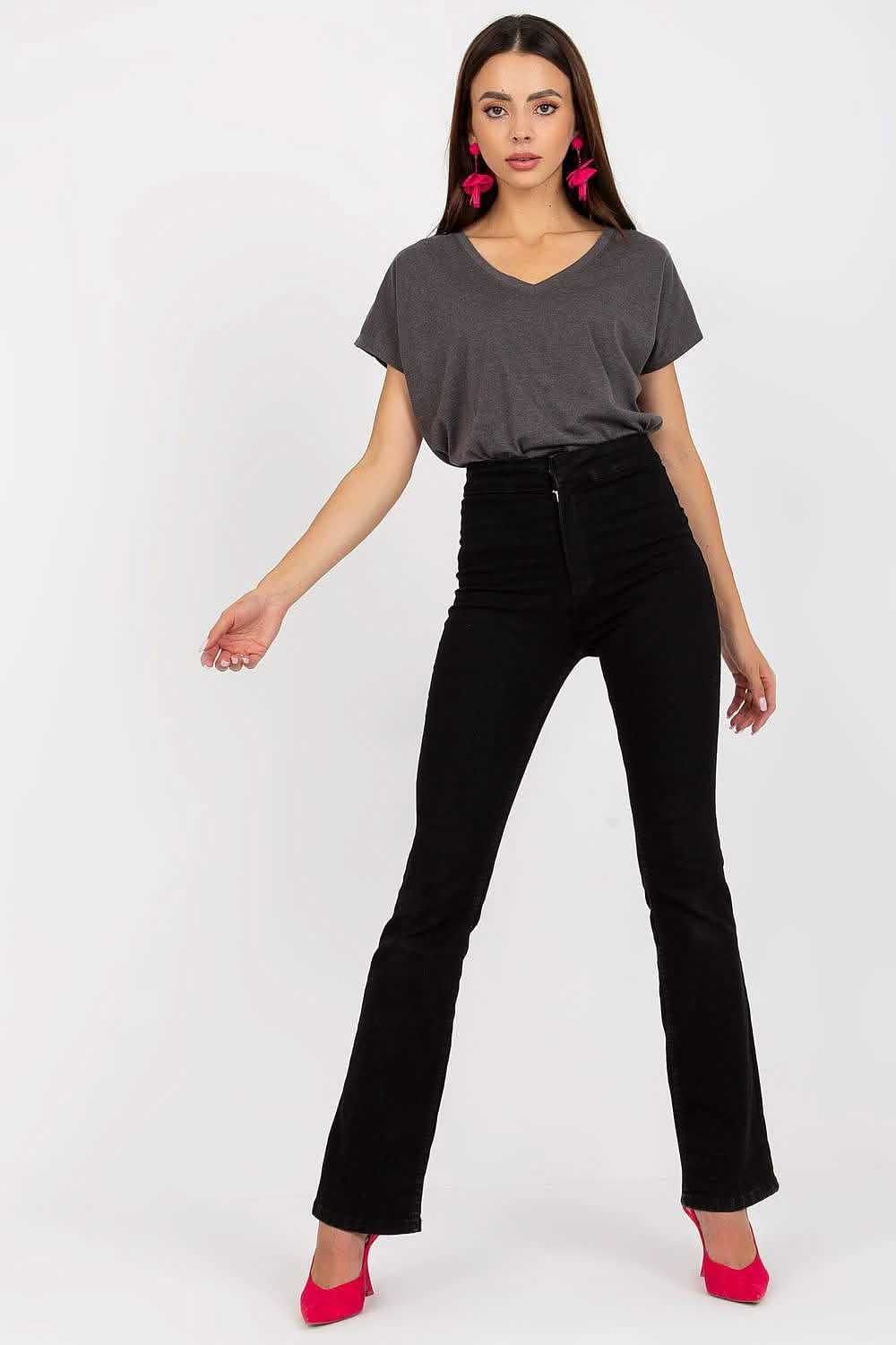 Black flared pants paired with a gray t-shirt and red heels.