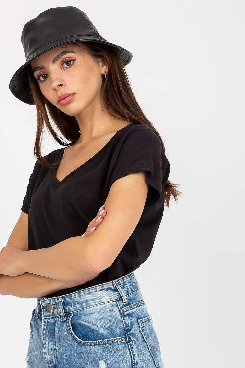 Black bucket hat worn with a casual outfit of v-neck tee and light wash jeans.