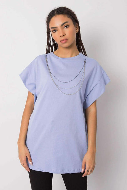 Lilac-colored oversized t-shirt with short rolled sleeves and a silver chain necklace accessory.