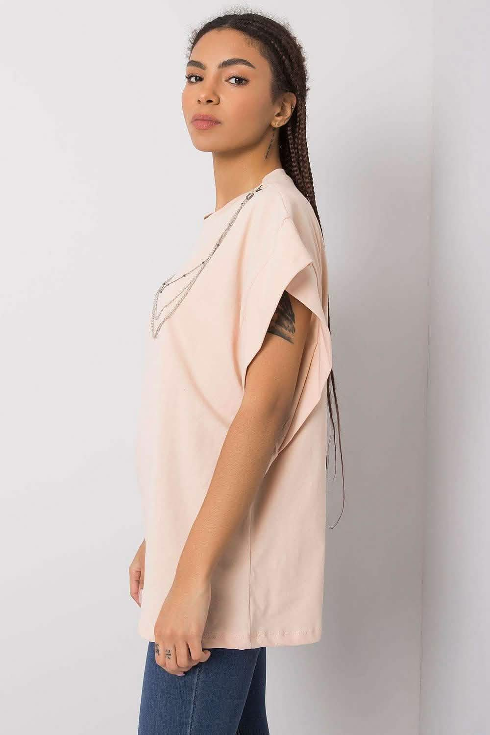 Pale pink sleeveless top with a pearl-embellished neckline.