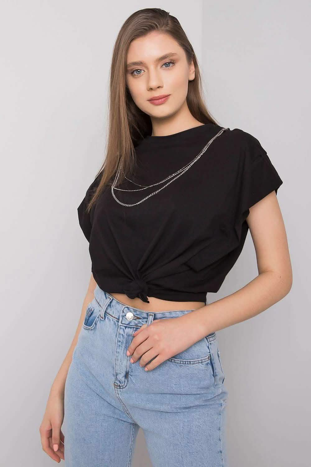 Black cropped t-shirt with layered silver chain necklace detail.