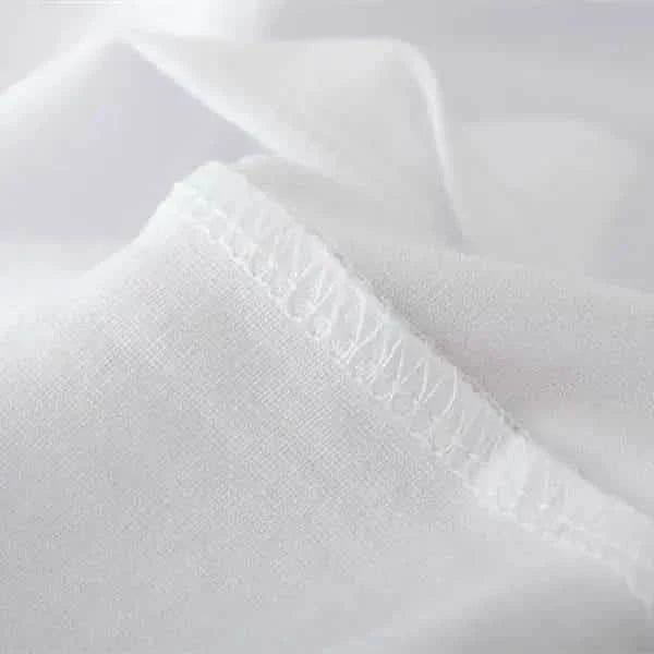 White fabric with a visible stitched hem.