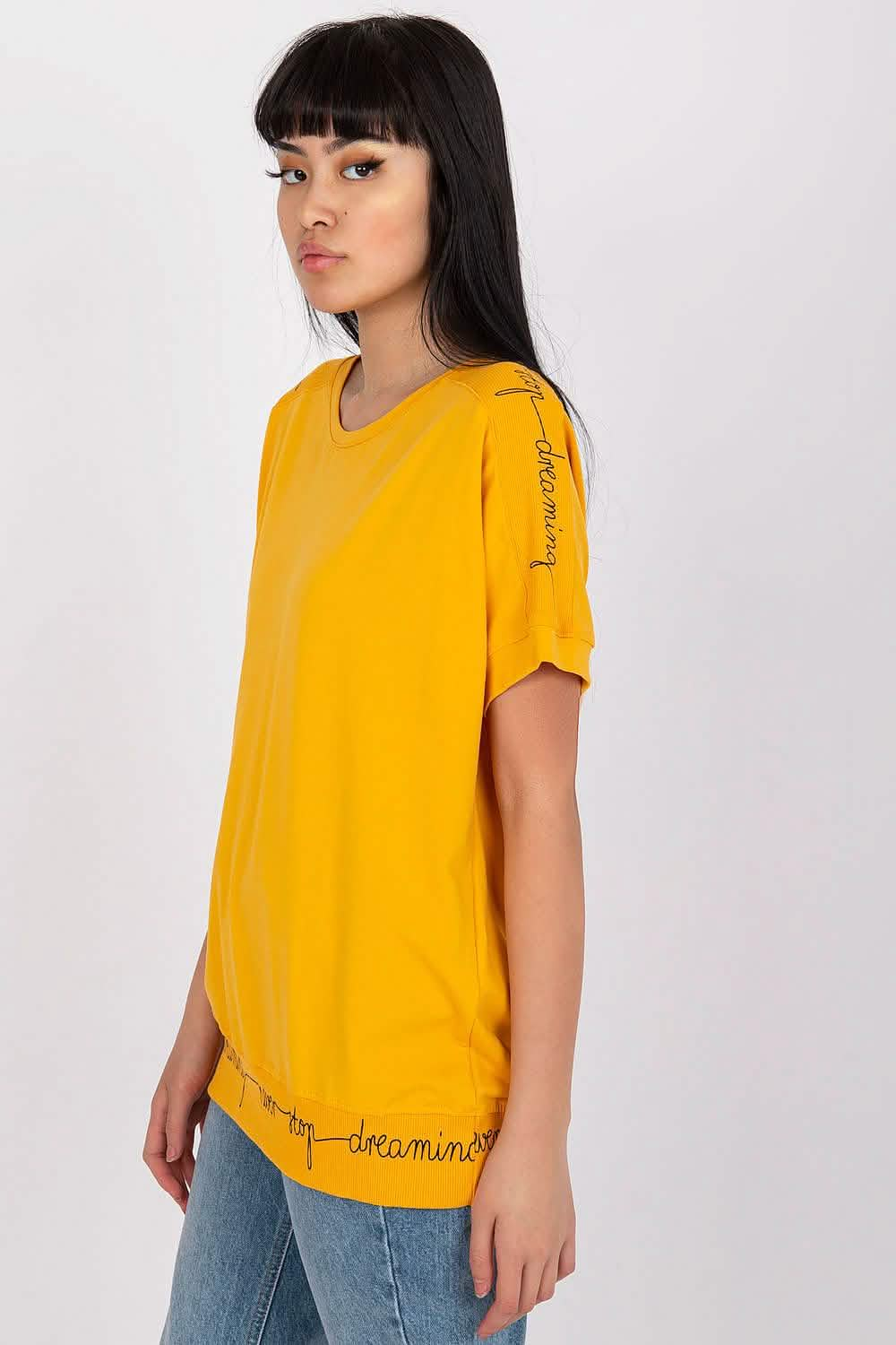 Bright yellow t-shirt with subtle text details along the edges.