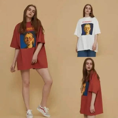 Oversized graphic t-shirts featuring a yellow face design in red and white colors.