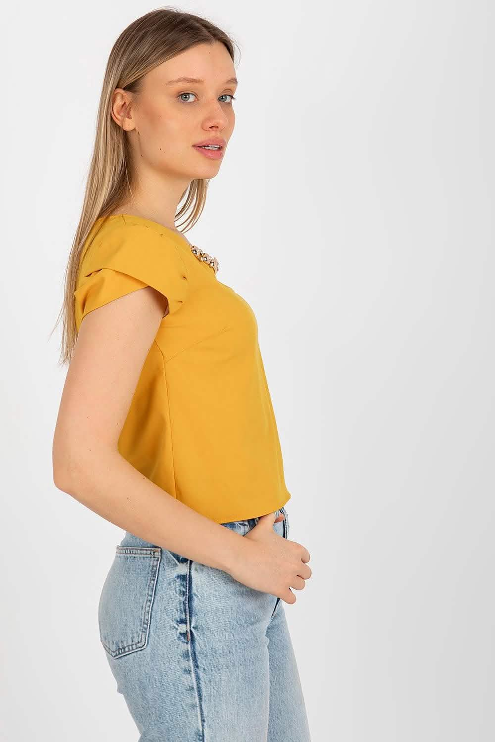 Mustard yellow cap-sleeve top with a round neckline.