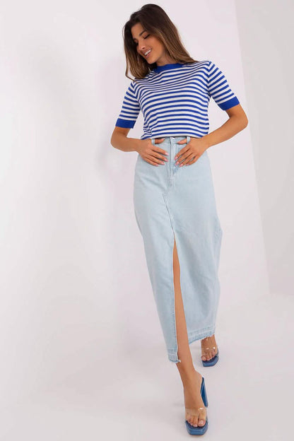 Casual outfit featuring a blue striped t-shirt paired with a light denim maxi skirt and blue sandals.