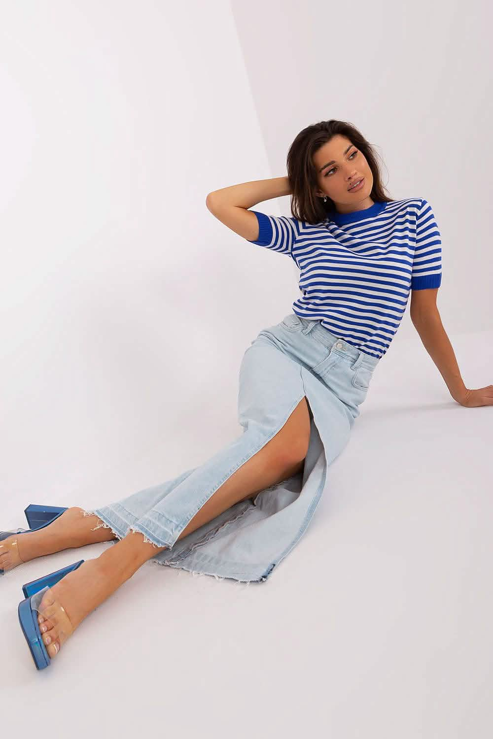 Casual outfit featuring a striped blue and white t-shirt paired with a light denim maxi skirt and blue heels.