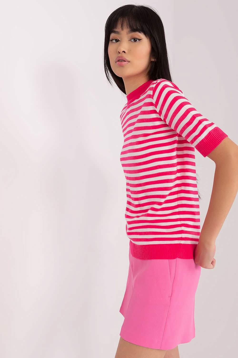 Pink and white striped t-shirt with a matching pink skirt.