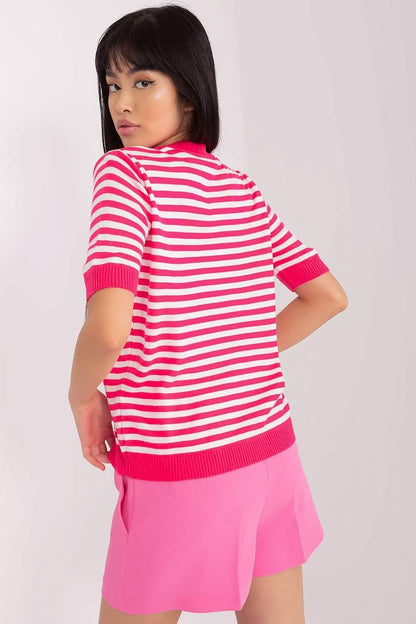 Pink and white striped short-sleeve sweater paired with a pink skirt.