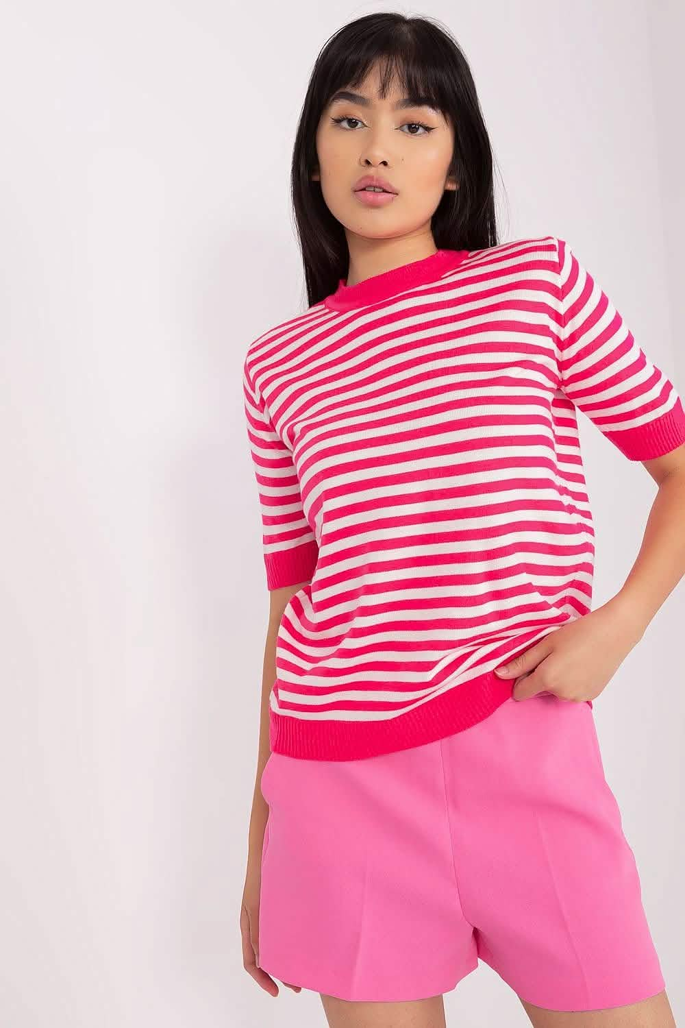 Red and white striped short-sleeve sweater with pink shorts.