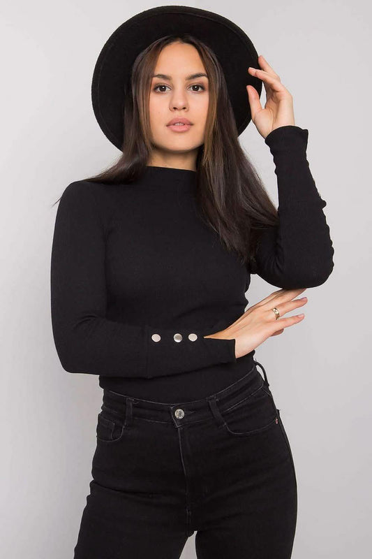 Black turtleneck sweater with button details on the sleeves.