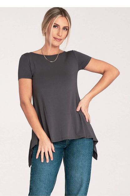 Dark gray short-sleeve top with asymmetrical hem worn with blue jeans.