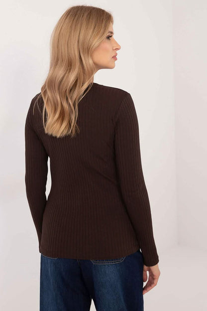 Brown ribbed sweater with long sleeves.