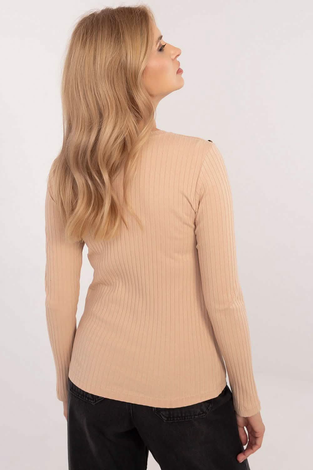 Beige ribbed long-sleeve top with a fitted silhouette.