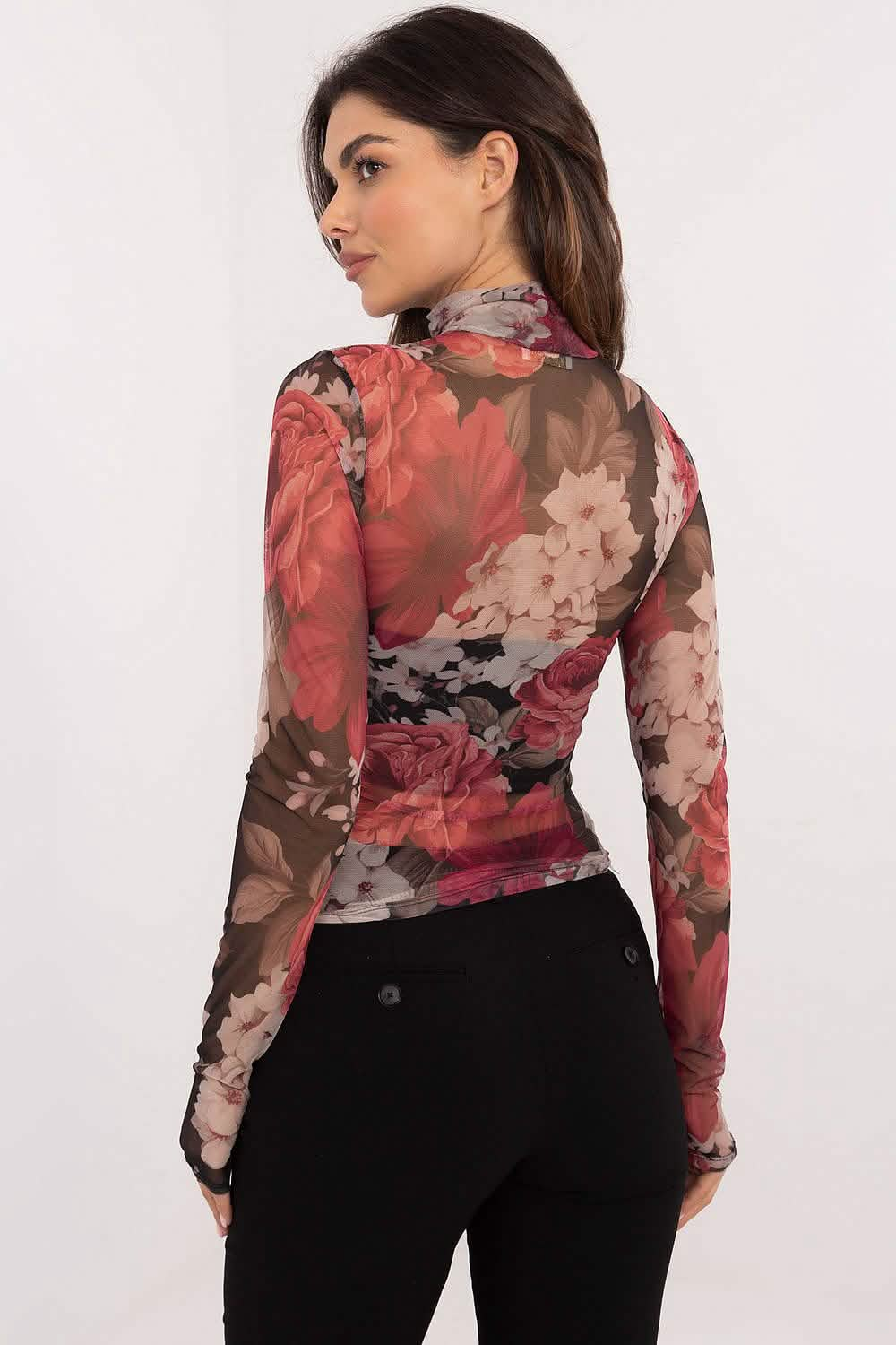 Floral mesh long-sleeve top in coral and brown tones paired with black pants.