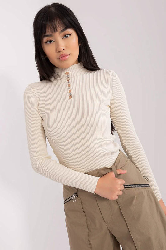 Cream-colored ribbed turtleneck sweater with decorative buttons at the collar.