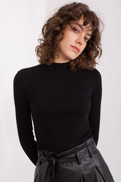 Black ribbed turtleneck sweater with long sleeves.