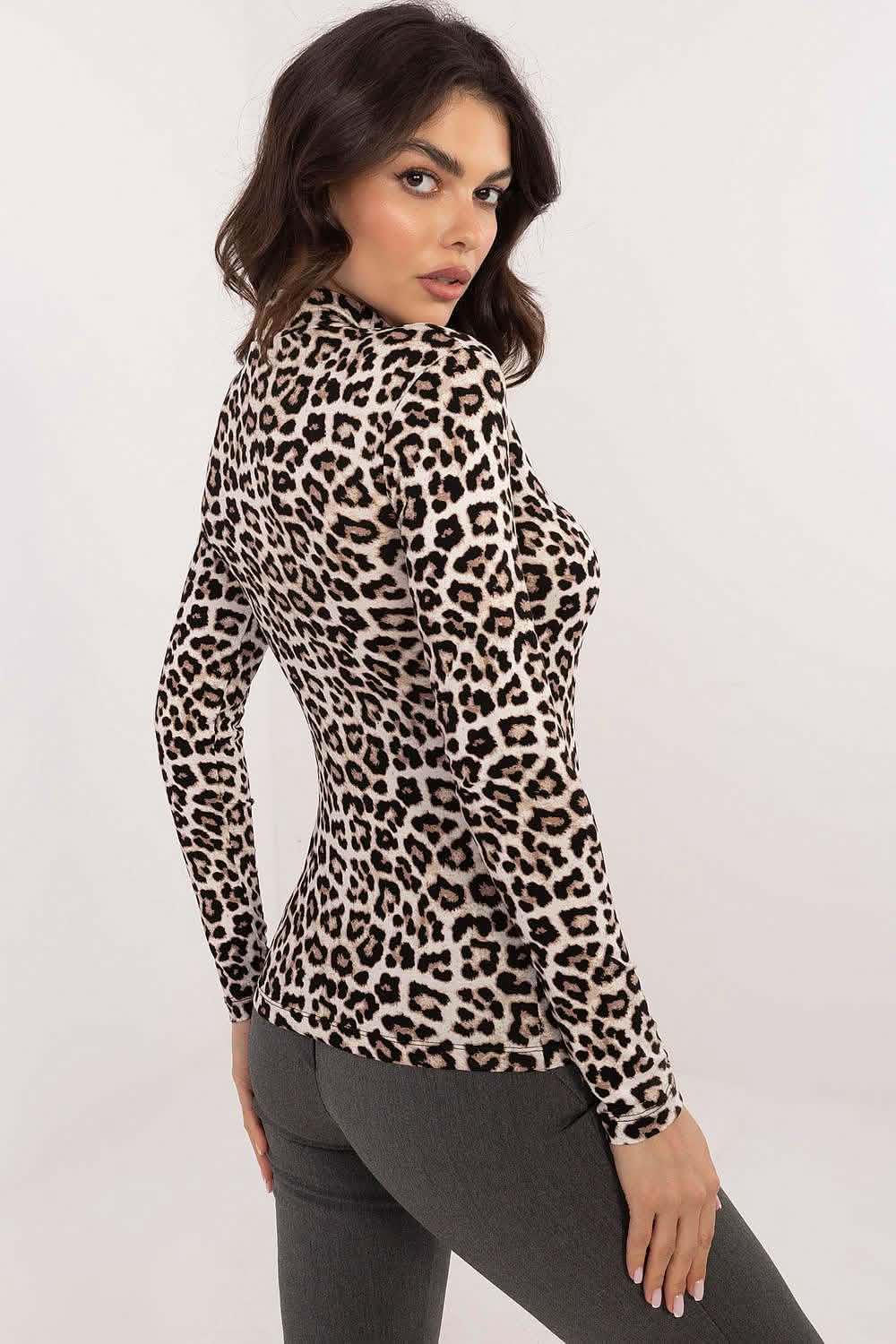 Leopard print turtleneck top with long sleeves.