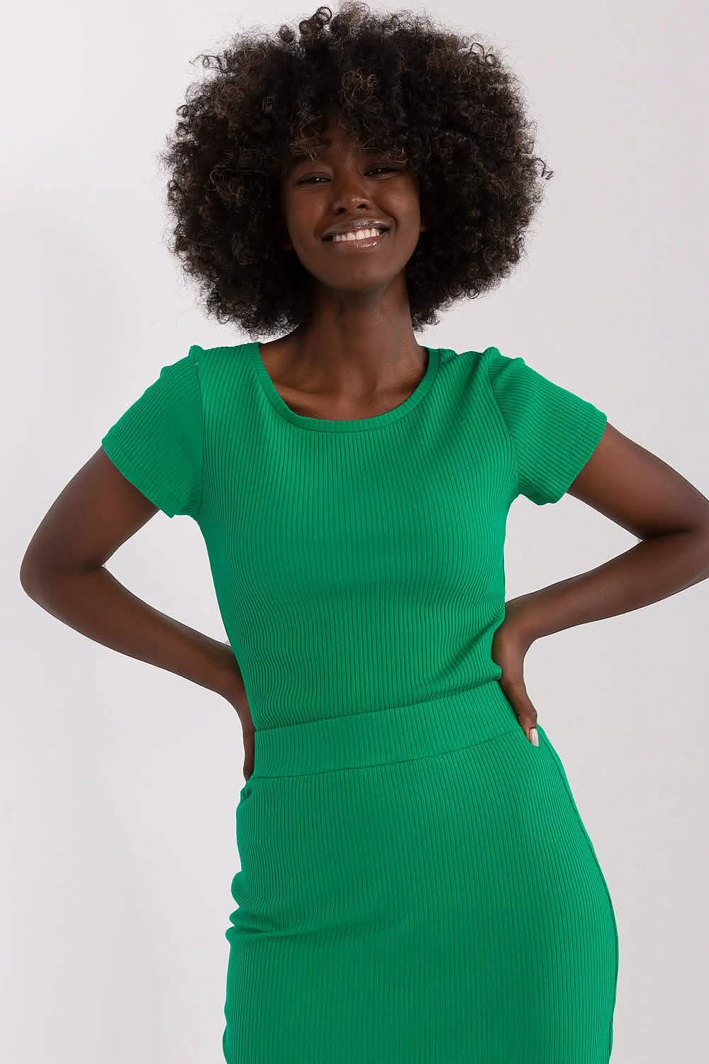 Vibrant green ribbed bodycon dress with short sleeves.