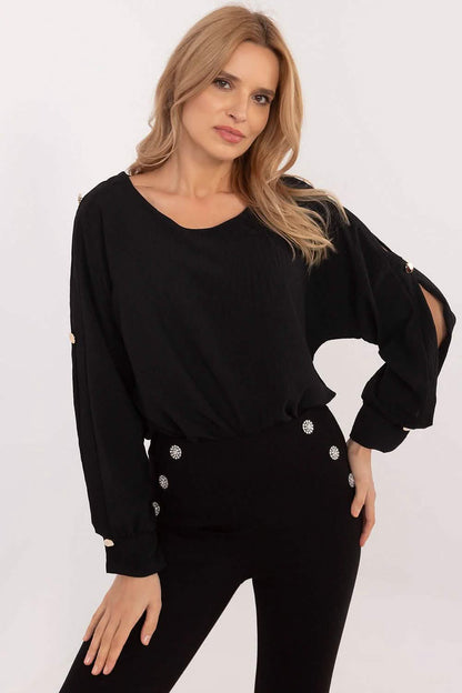 Black knit sweater with split balloon sleeves and decorative buttons at the waist.