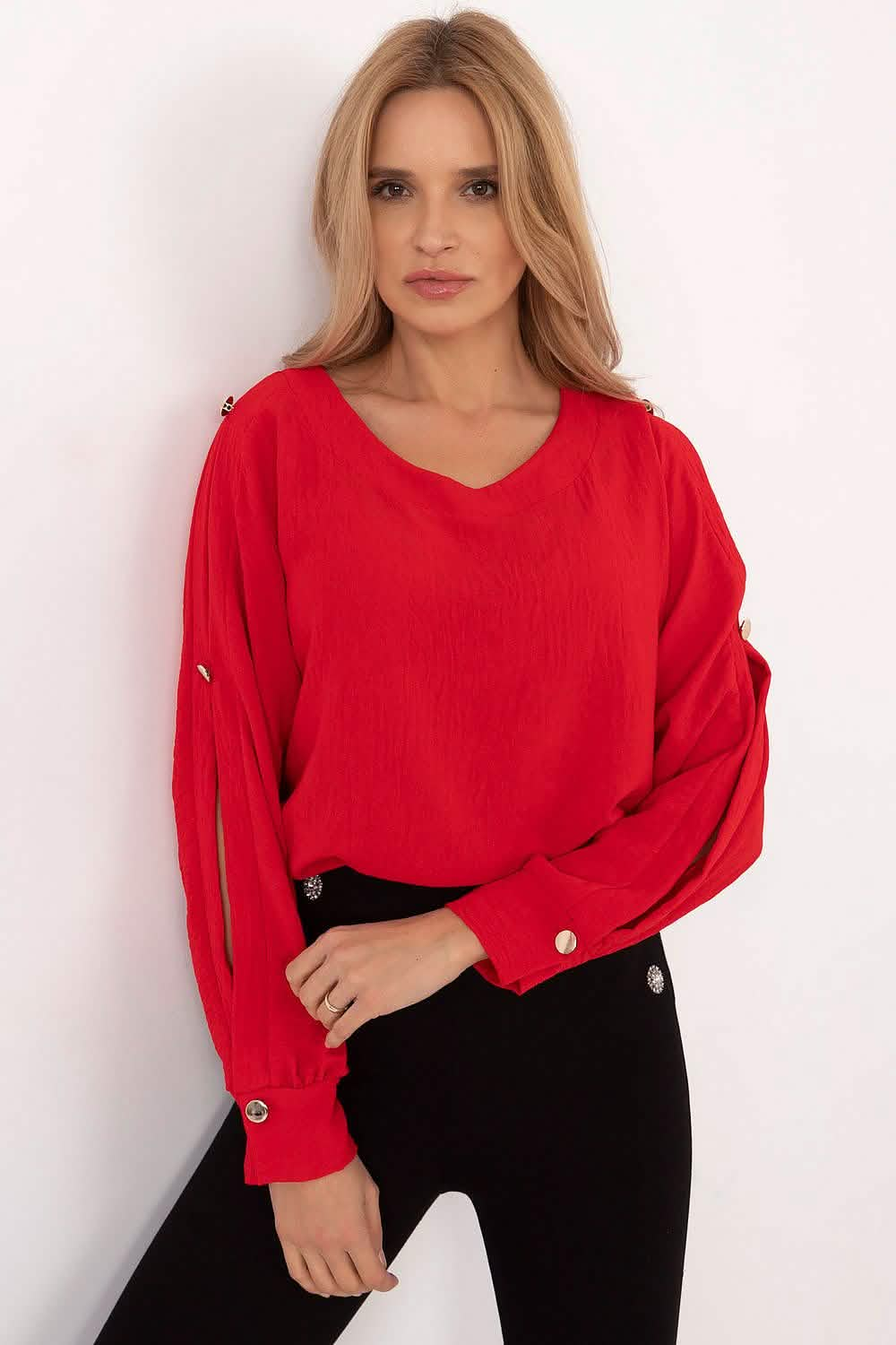 Red v-neck sweater with decorative buttons along the sleeves.