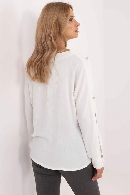 White long-sleeved button-back blouse with a relaxed fit.