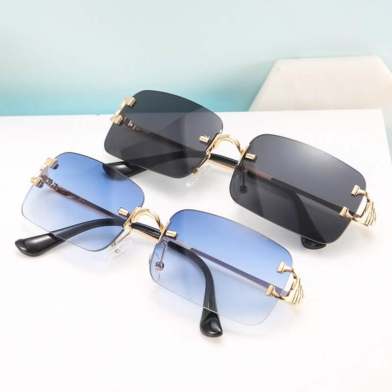 Two pairs of trendy small-frame sunglasses with gold-tone trim, one in black lenses and the other in gradient blue lenses.