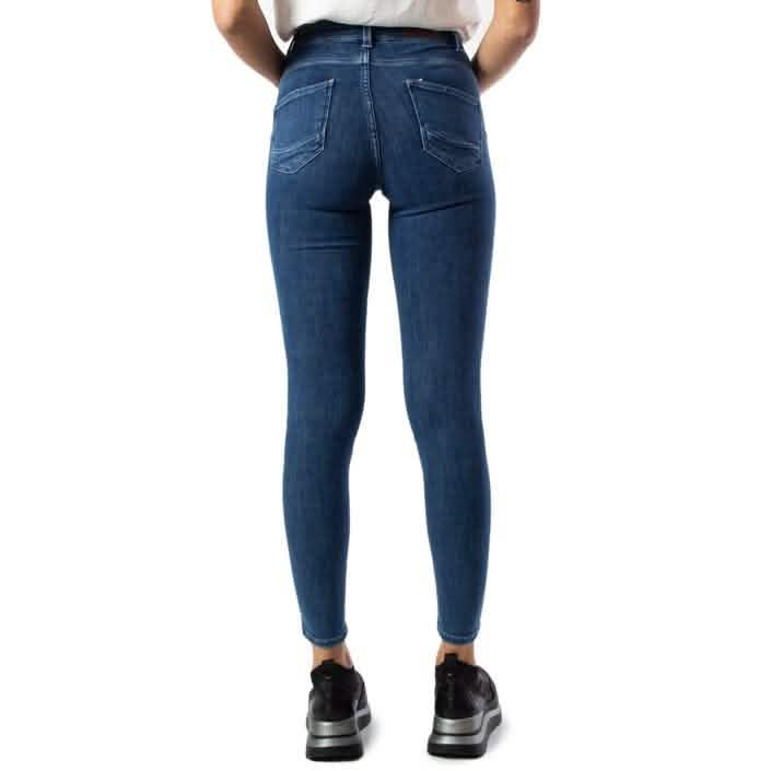 Dark blue skinny jeans with back pockets shown from behind.