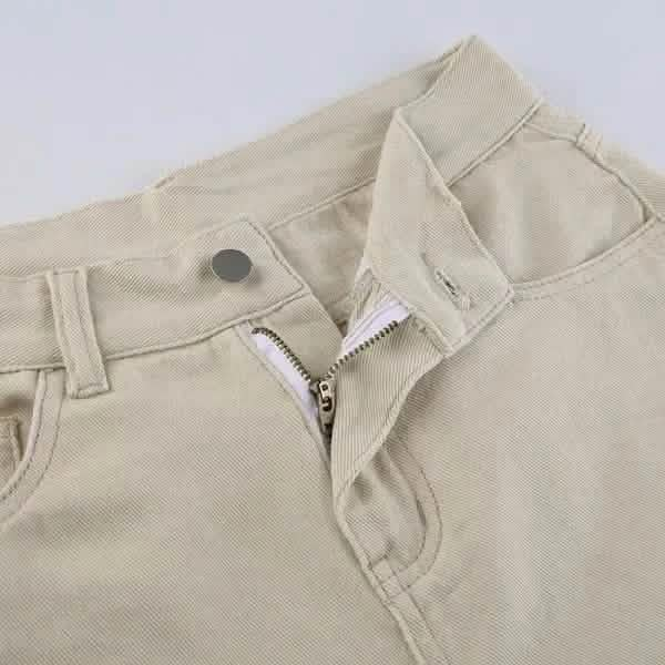 Beige pants with an open zipper fly.