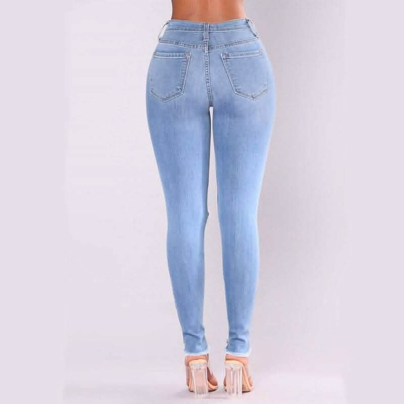 Light blue high-waisted skinny jeans with back pockets.